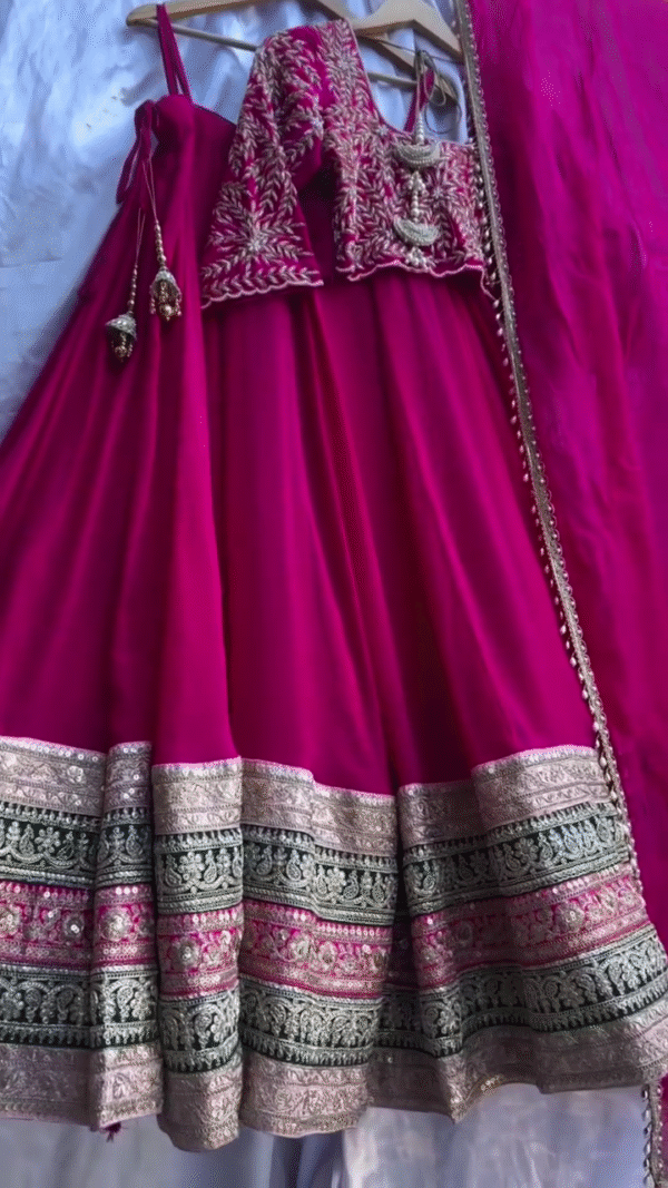 Rani Pink Traditional Lehenga Choli Set with Heavy Embroidered Mirror Work Blouse, Gold Zari Woven Border, and Matching Dupatta – Perfect for Weddings, Festivals, and Special Occasions