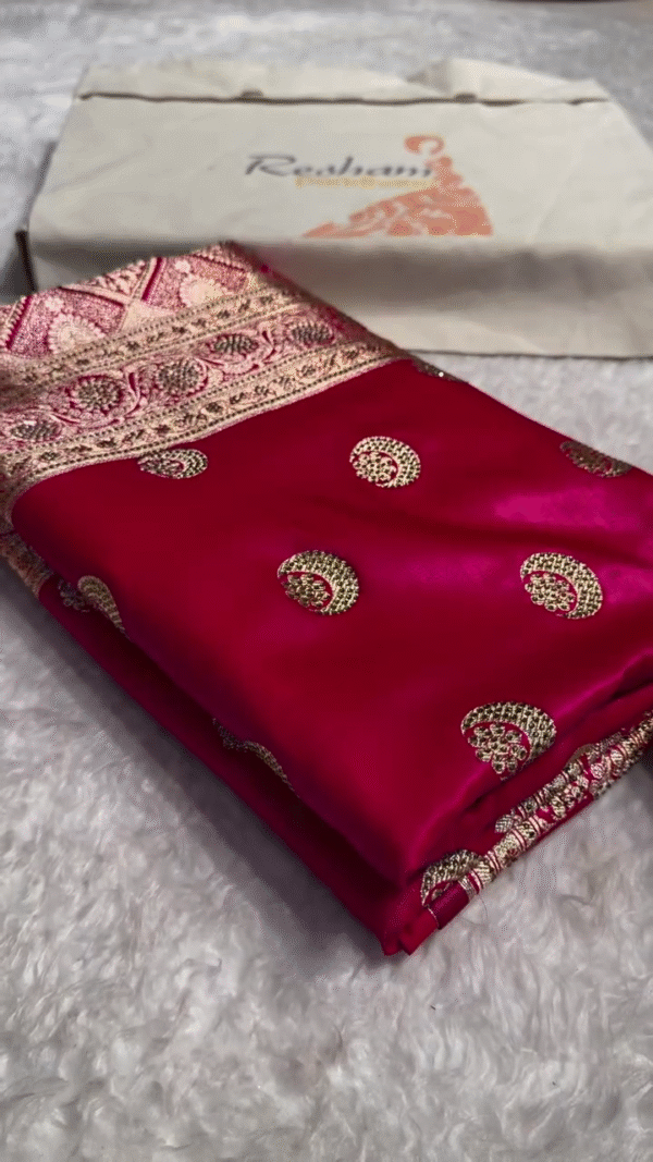 Wine Pink Banarasi Silk Saree with Rich Golden Zari Woven Circular Butta Motifs and Intricately Designed Traditional Floral Brocade Border for Festive and Wedding Wear