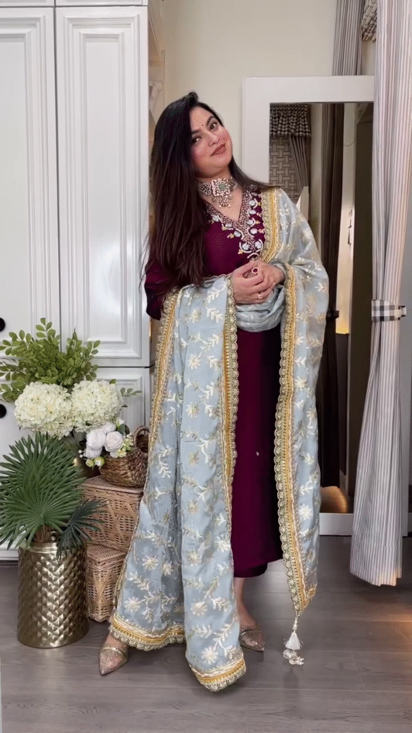 Maroon Embroidered Long Kurta with Heavily Embellished Sky Blue Net Dupatta Featuring Golden Floral Detailing and Traditional Jewelry Accents – Perfect for Festive and Wedding Occasions