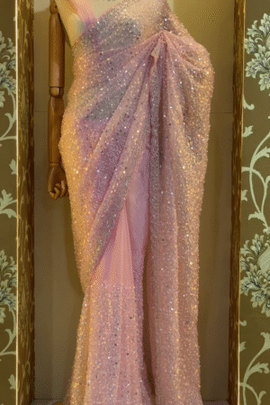 Glamorous Baby Pink Soft Net Saree Featuring All Over Heavy Sequin Embellishments with Delicate Lace Border Detailing, Ideal for Cocktail Parties, Sangeet Functions, and Evening Celebrations