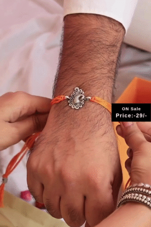 Elegant Red and Yellow Mauli Thread Rakhi Featuring Intricately Designed Antique Silver-Tone Floral Charm – A Traditional and Thoughtful Raksha Bandhan Bracelet for Brother