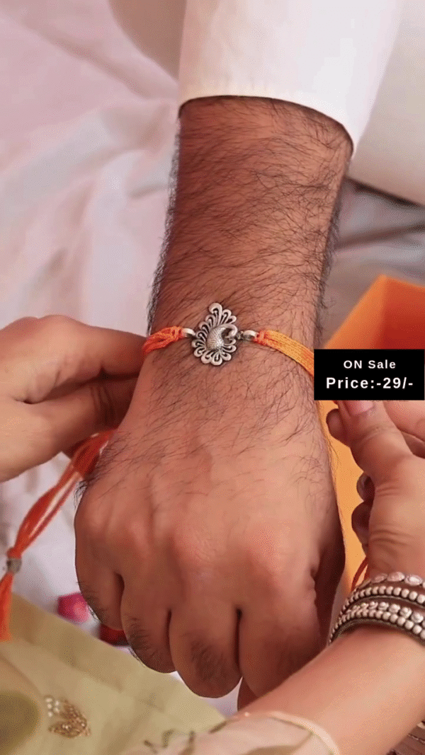 Elegant Red and Yellow Mauli Thread Rakhi Featuring Intricately Designed Antique Silver-Tone Floral Charm – A Traditional and Thoughtful Raksha Bandhan Bracelet for Brother