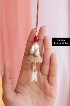 Golden Lumba Rakhi with Pearl Drops, Red Bead Accents, and Decorative Dome Design Paired with Matching Pearl Drop Oxidized Silver Toe Rings – A Graceful Raksha Bandhan Combo Set for Bhabhi Showcasing Traditional Charm and Festive Style